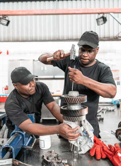 Transmission repair technicians at work